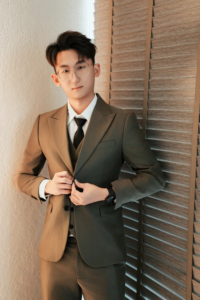 Real portrait of Davis Chan in a suit